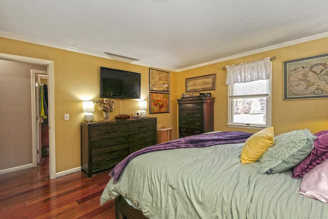 bedroom with crown molding, dark wood-type flooring, and a textured ceiling