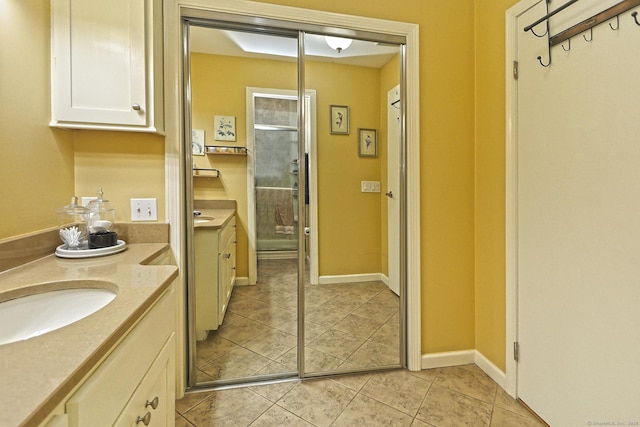 bathroom featuring sink and tile patterned flooring