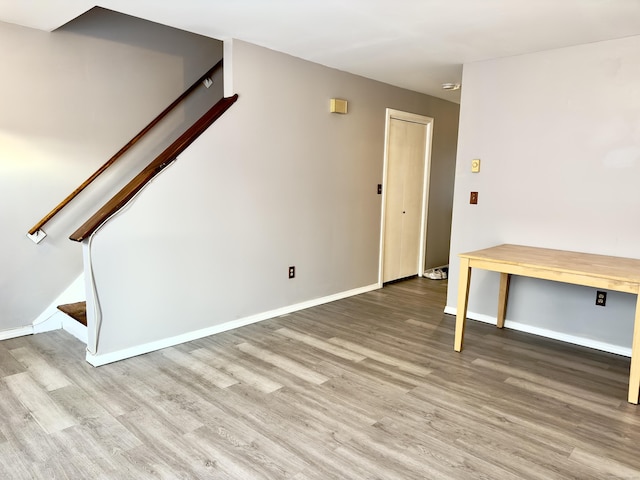 spare room featuring wood-type flooring