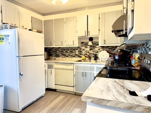 kitchen with exhaust hood, white appliances, ornamental molding, and sink