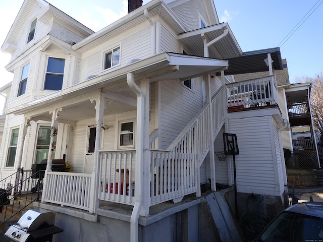 view of side of home featuring a porch