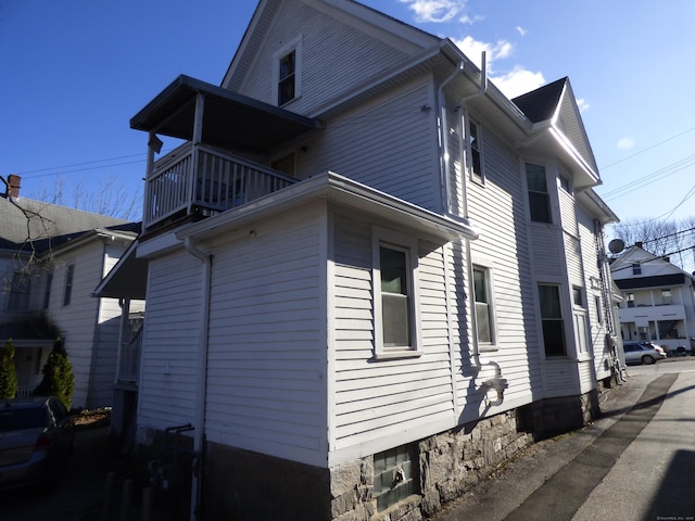 view of property exterior featuring a balcony