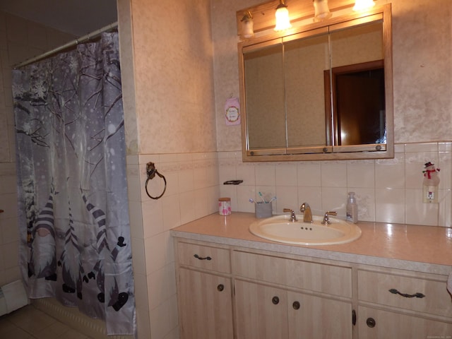 bathroom featuring a shower with shower curtain, vanity, and baseboard heating