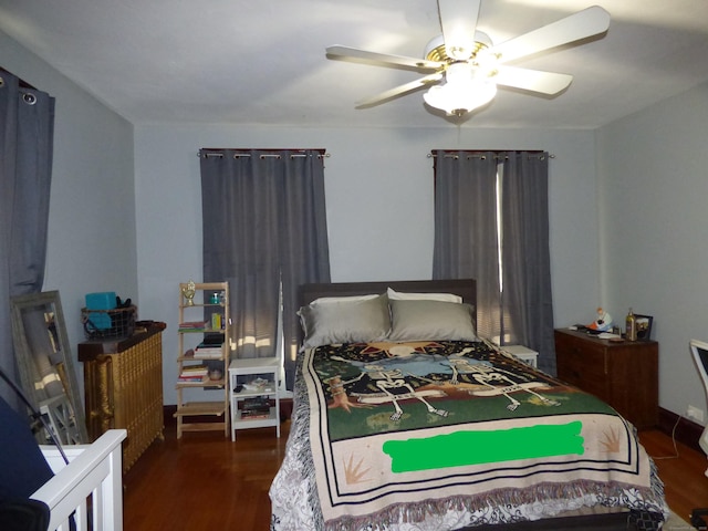 bedroom featuring ceiling fan and dark hardwood / wood-style floors