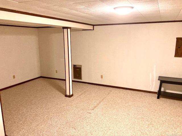 basement featuring crown molding and light carpet