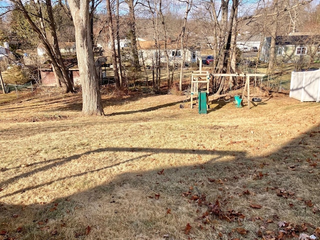 view of play area featuring a lawn