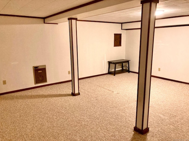 basement featuring carpet floors and crown molding