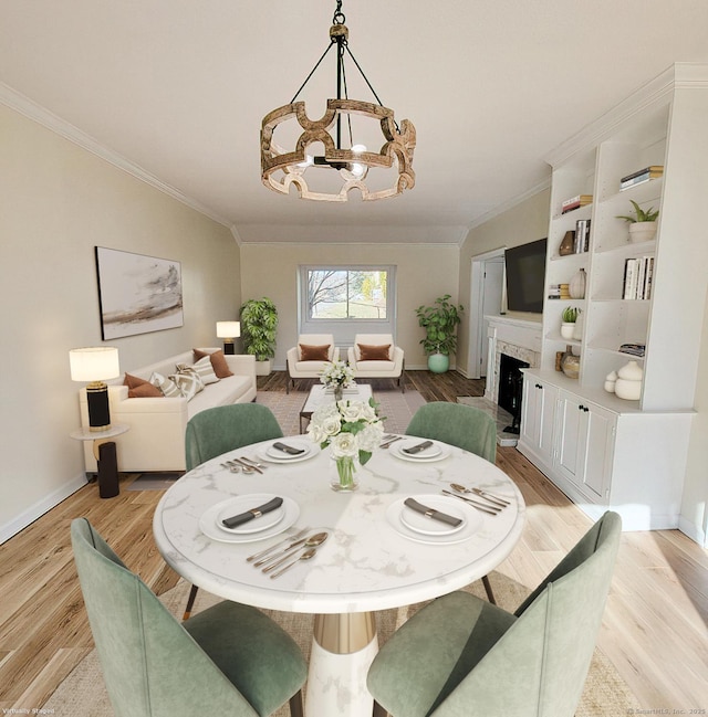 dining area with a notable chandelier, crown molding, and light hardwood / wood-style floors