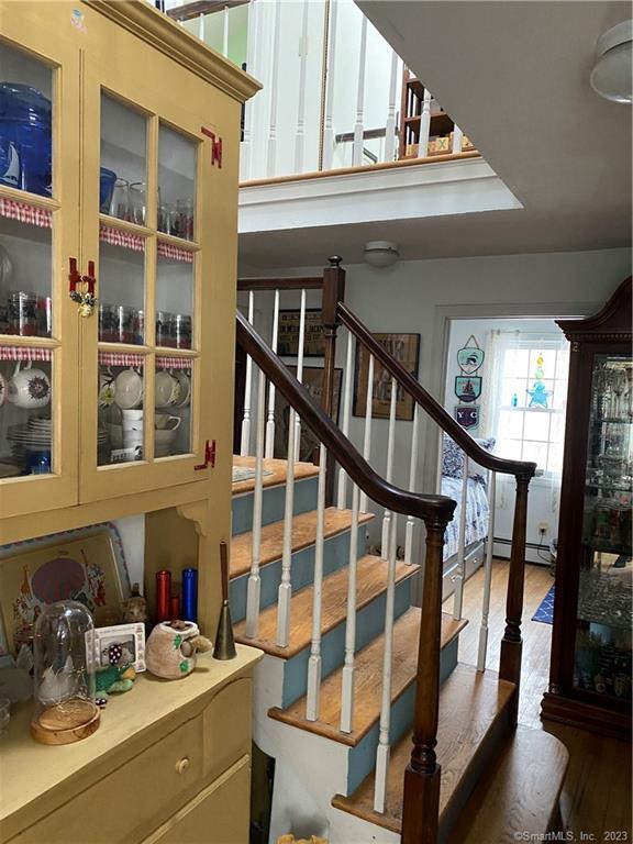 staircase featuring hardwood / wood-style flooring