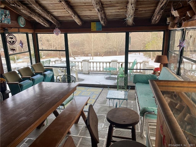 sunroom with beamed ceiling and wooden ceiling