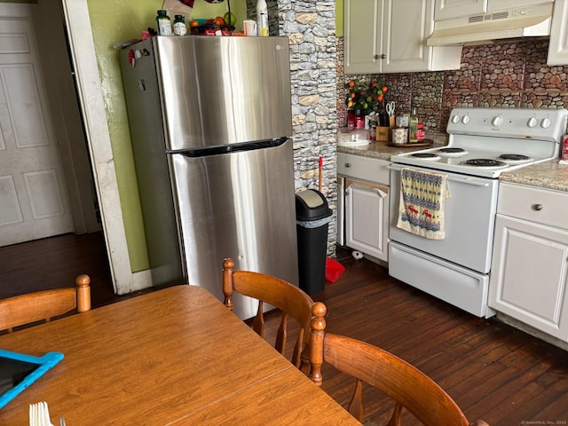 kitchen featuring stainless steel fridge, backsplash, white cabinetry, and white electric stove