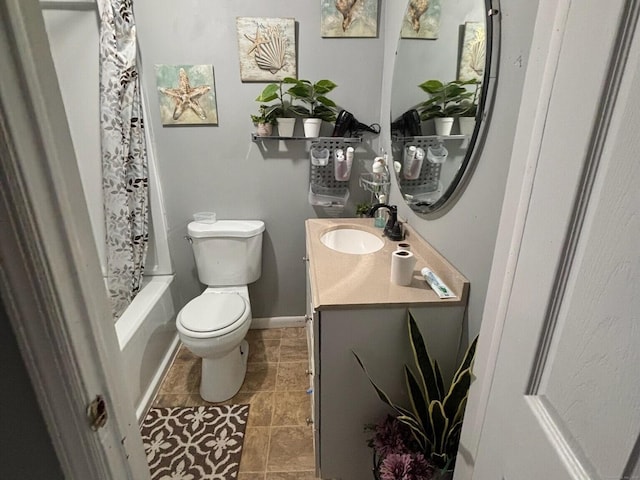 full bathroom with vanity, toilet, and shower / tub combo