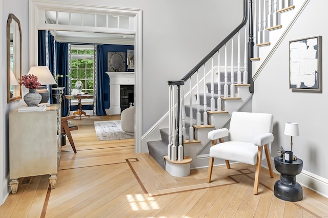 staircase with hardwood / wood-style flooring