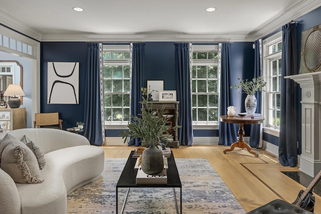 living room with wood-type flooring and ornamental molding