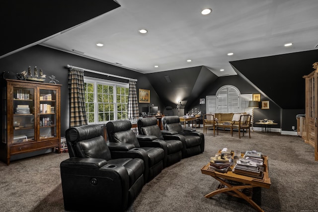 home theater with carpet floors and vaulted ceiling