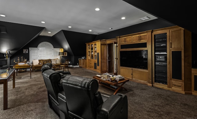 carpeted cinema with lofted ceiling and wine cooler