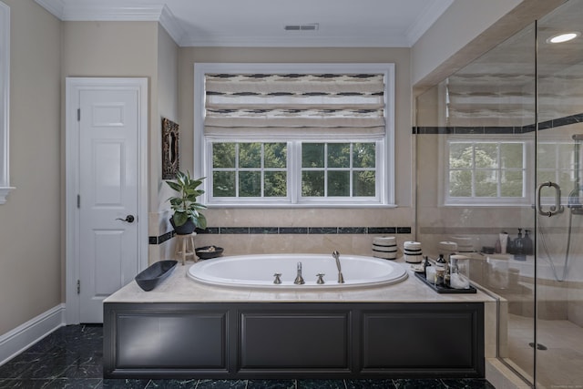 bathroom with ornamental molding and independent shower and bath