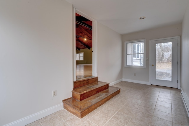 doorway to outside featuring wood ceiling, lofted ceiling, and light tile patterned flooring