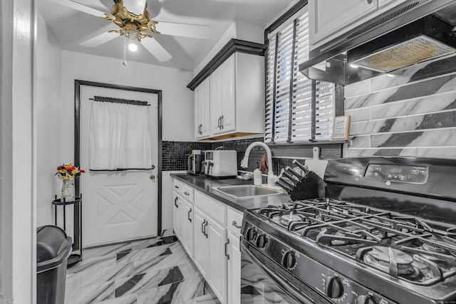 kitchen featuring decorative backsplash, black range with gas cooktop, ventilation hood, sink, and white cabinetry