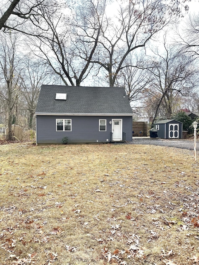 exterior space featuring a storage shed and a front lawn