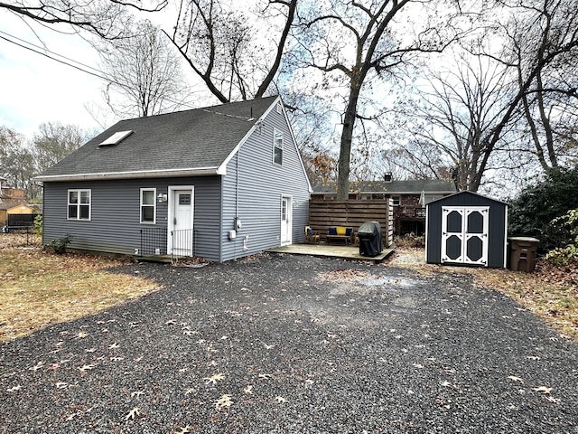 exterior space featuring a storage shed and a patio