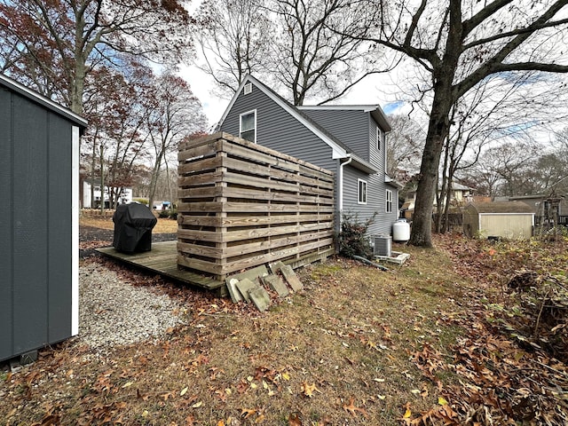 view of property exterior featuring a shed