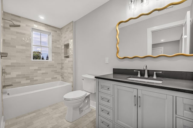 full bathroom featuring recessed lighting, shower / bath combination, toilet, vanity, and baseboards