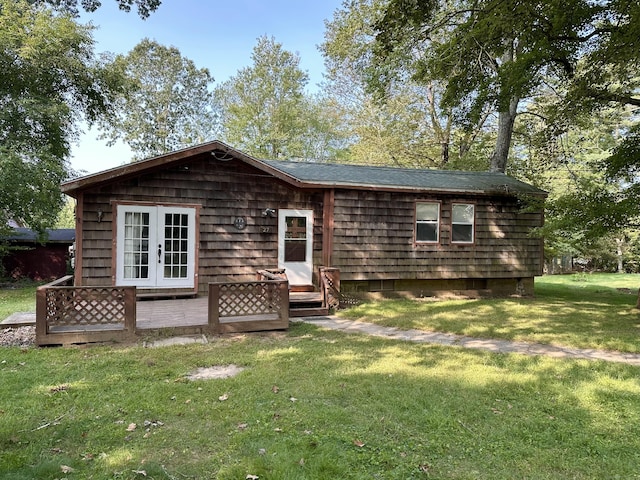 back of house featuring a yard