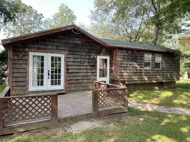 exterior space with a yard and french doors