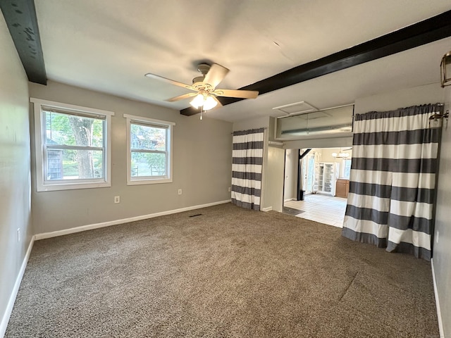 spare room featuring ceiling fan and light carpet