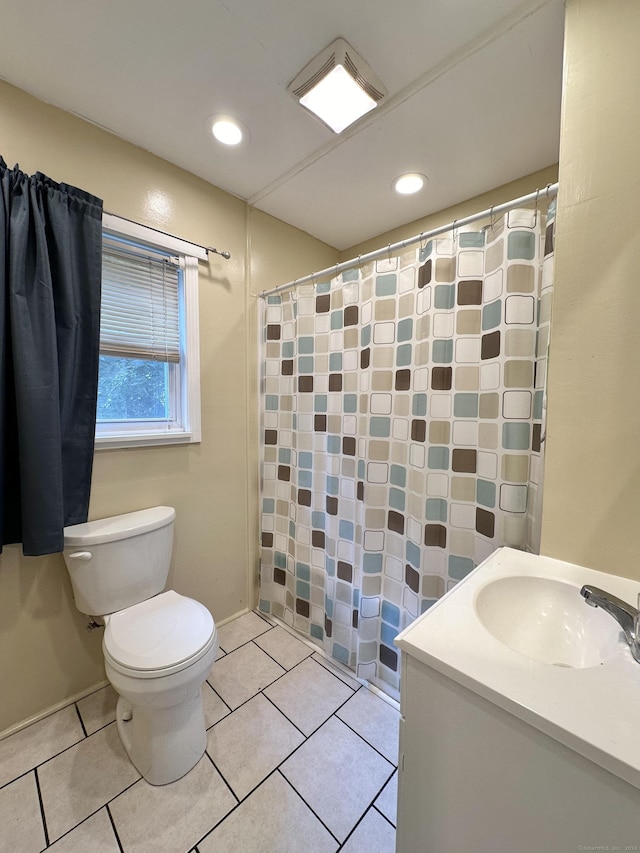 bathroom with tile patterned floors, vanity, and toilet