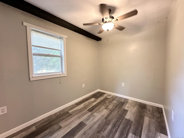 empty room featuring beamed ceiling, ceiling fan, and dark hardwood / wood-style flooring