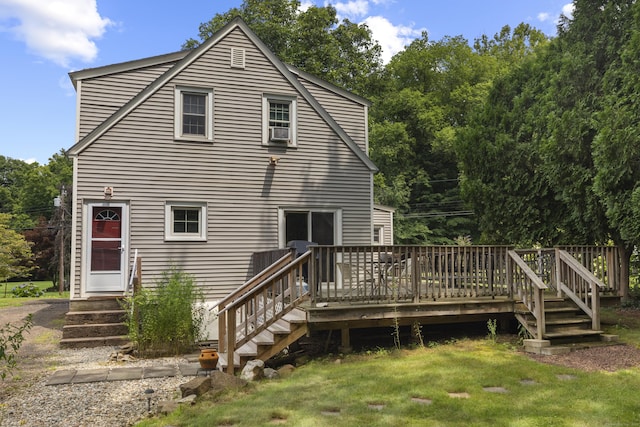 back of house with a yard, a deck, and cooling unit