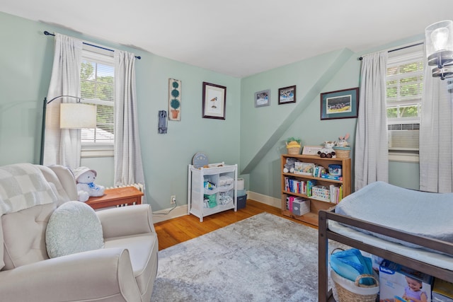 bedroom with hardwood / wood-style flooring