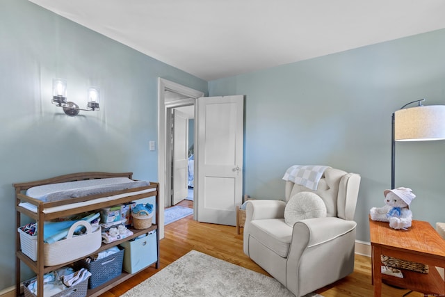 living area with light hardwood / wood-style floors