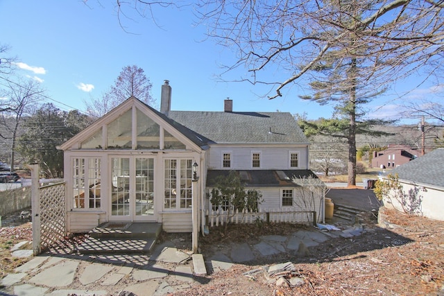 back of property featuring a sunroom