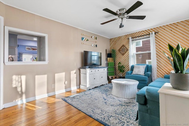 living room featuring ceiling fan and wood-type flooring