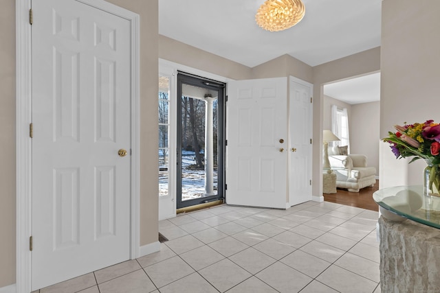 foyer featuring light tile patterned floors