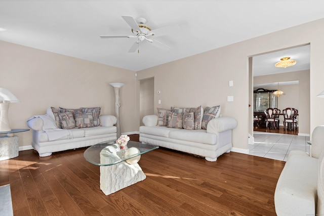 living room featuring hardwood / wood-style floors and ceiling fan