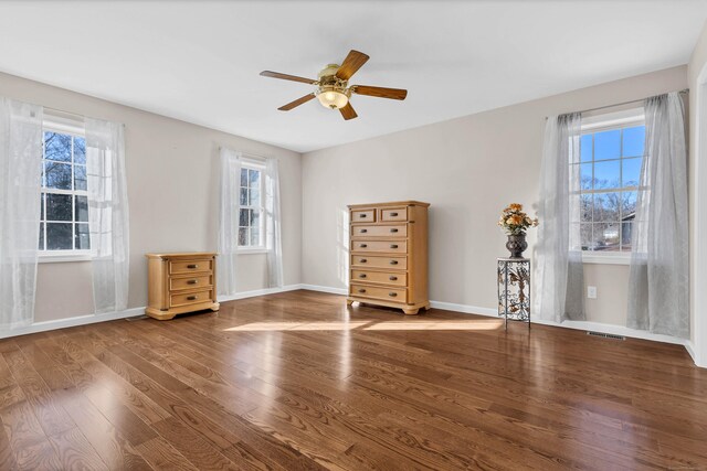 unfurnished bedroom featuring hardwood / wood-style flooring and ceiling fan