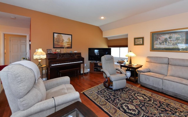 living room with dark wood-type flooring and lofted ceiling