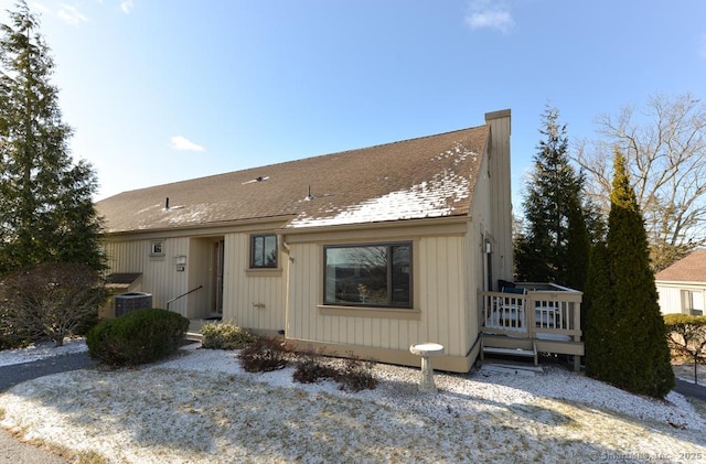 view of front of house with central AC unit and a wooden deck