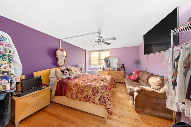 bedroom featuring ceiling fan and light hardwood / wood-style flooring