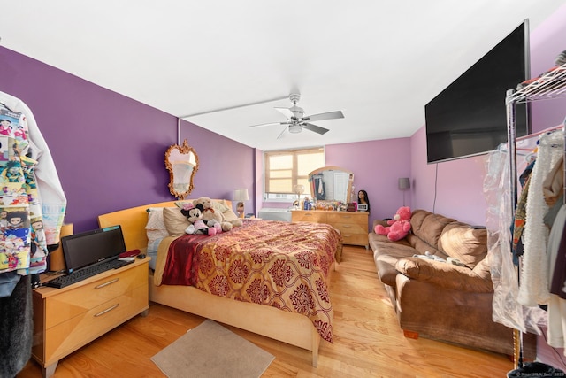 bedroom featuring ceiling fan and light wood-type flooring