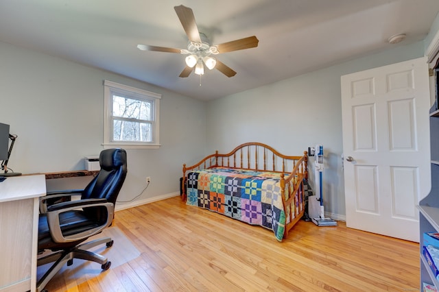 bedroom featuring light wood-type flooring and ceiling fan