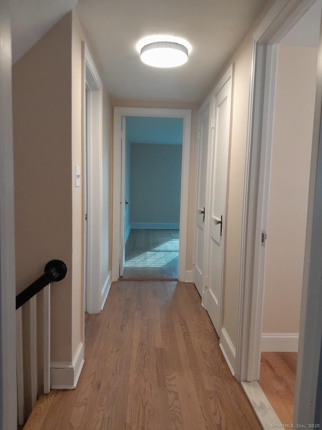 hallway featuring light hardwood / wood-style flooring