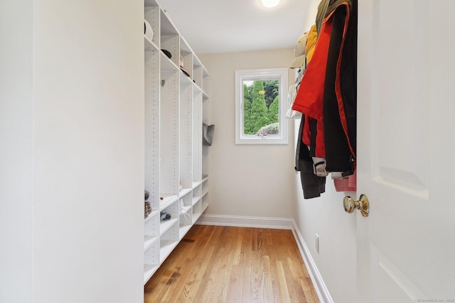 walk in closet featuring hardwood / wood-style flooring