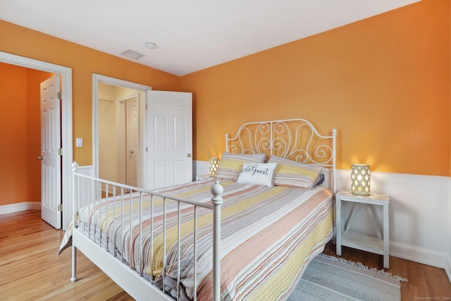 bedroom with wood-type flooring