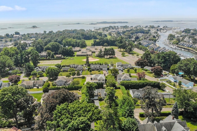 birds eye view of property with a water view