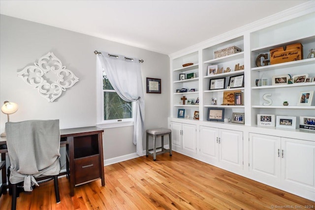 office with light hardwood / wood-style flooring